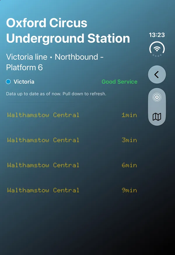 iPhone Duo closed: the Victoria line board at Oxford Circus, with the Back, Live Activity and map buttons in a column on the right-hand side