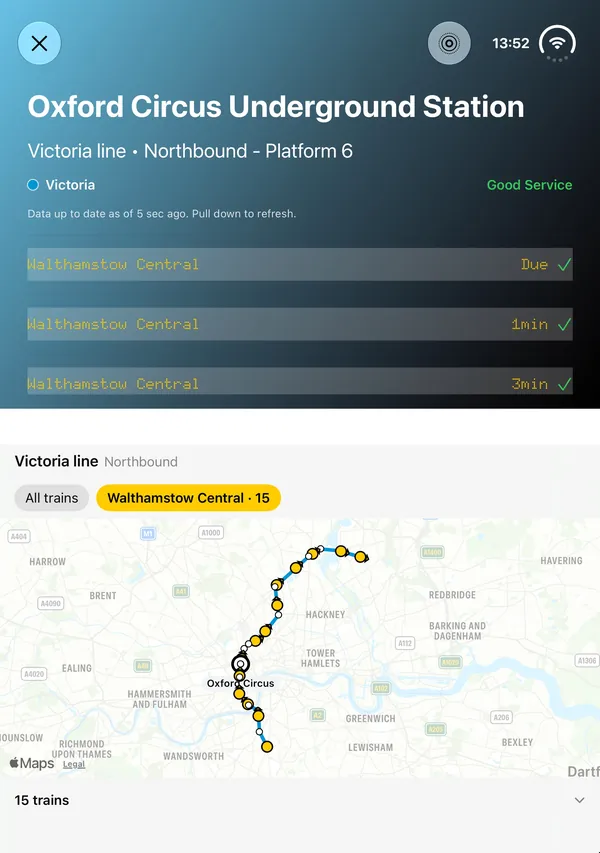 iPhone Duo stood like a laptop: the Victoria line board at Oxford Circus on the upper half, the live line map on the lower half