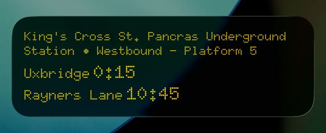 A Live Activity for King's Cross St. Pancras, westbound platform 5: Uxbridge in 0:15 and Rayners Lane in 10:45, in amber dot-matrix type